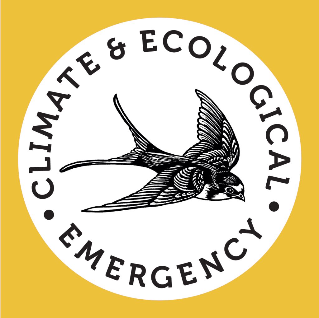 A bird in a white circle with a yellow background and the words 'cliamte and ecological emergency'.